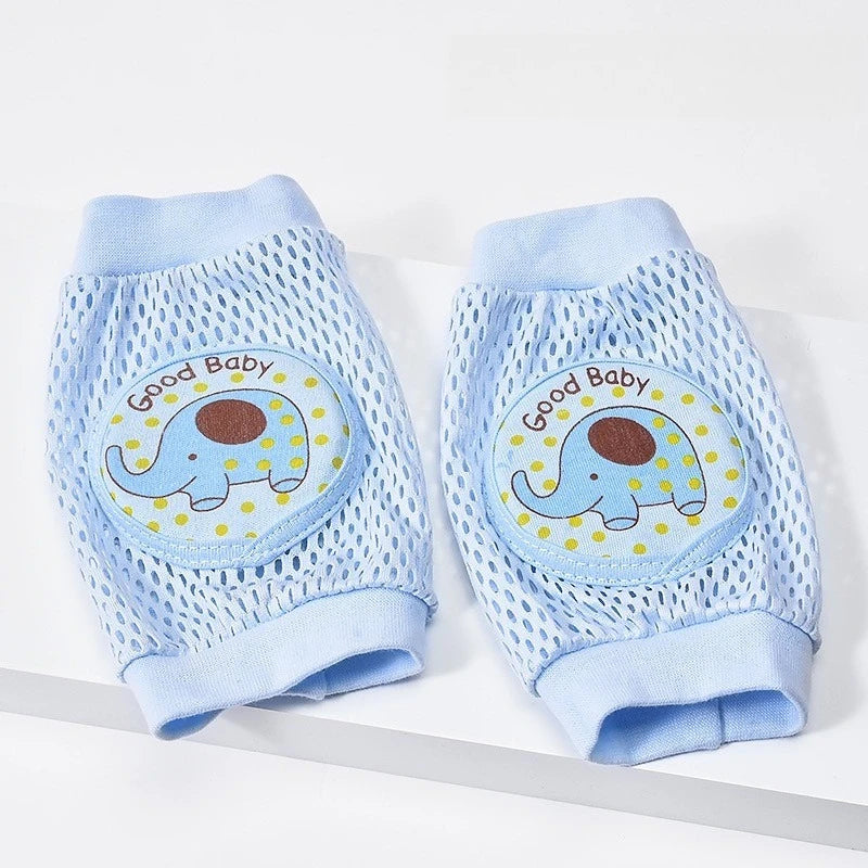 Pair of blue baby knee pads with elephant design and 'Good Baby' text on a white background