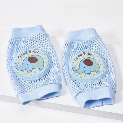 Pair of blue baby knee pads with elephant design and 'Good Baby' text on a white background